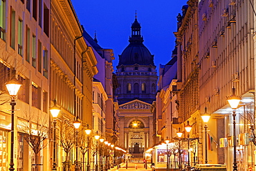 View along illuminated Zrinyi street, Hungary, Budapest, Saint Stephen's Basilica