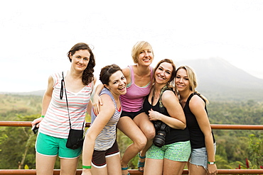 Smiling women by railing, Costa Rica