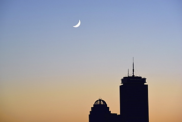 Crescent moon above office buildings, USA, Massachusetts, Boston, Back Bay