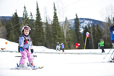 Little girl (2-3) learning skiing , USA, Montana, Whitefish