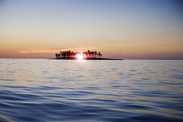 Sunset over tropical island