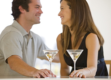 Couple drinking martinis