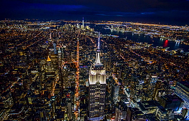 USA, New York, New York City, Manhattan, Aerial view of illuminated skyline at night