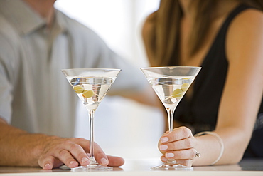 Couple drinking martinis