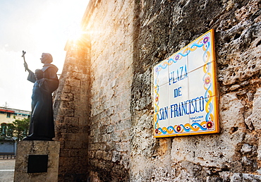 Cuba, Havana, Plaza De San Francisco, Tile sign next to statue of Francis of Assisi