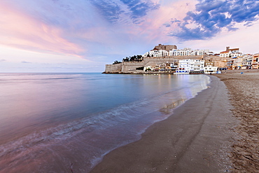 Spain, Valencian Community, Peniscola, Waterfront town at sunset