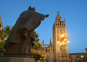 Spain, Seville, Plaza Virgin De Los Reyes, Statue and Girlada Tower