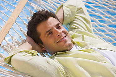 Man laying in hammock