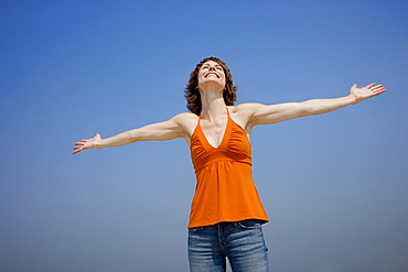 Woman with arms outstretched