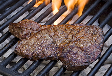 Steak cooking on grill