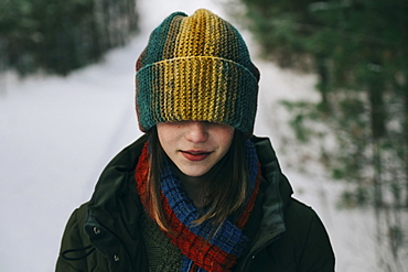 Teenage girl with colorful woollen hat during winter