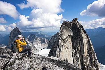 Man photographing mountain in Bugaboo Provincial Park, British Columbia, Canada