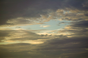 Sun shining through cloudy sky