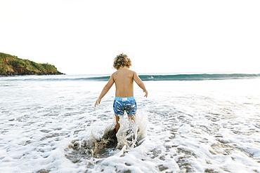 Boy playing on beach