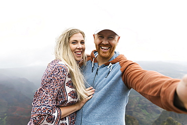 Mid adult couple taking selfie