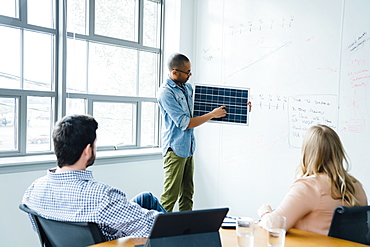 Man using diagram during board room presentation