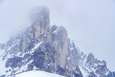 Ra Gusela mountain peak in fog in Dolomites, Passo Giau, Belluno, Italy