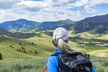 Rear view of mature woman hiking in Sun Valley, Idaho, USA