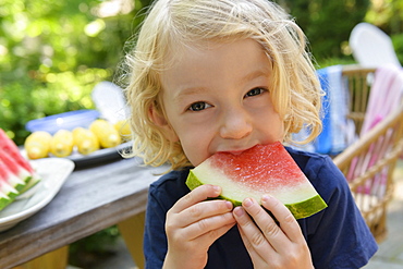 Boy eating watermelon