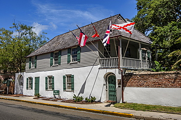 House with multiple flags in St. Augustine, USA