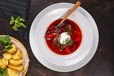 Beetroot soup with side of potatoes