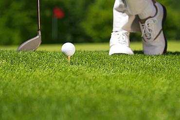 Golfer preparing to tee off