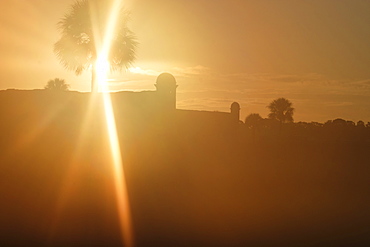 Silhouette of Castillo de San Marcos at sunset in St. Augustine, USA