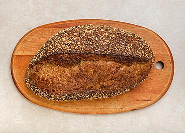 Loaf of bread on cutting board