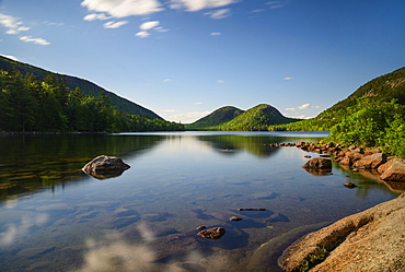 Rocks in Jordan Pond by hills in Acadia National Park, Maine, USA