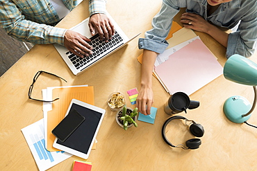 Coworkers working at office desk