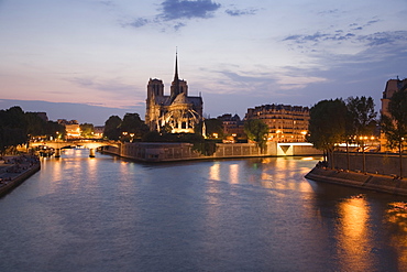 Scenic view of cathedral next to water at night