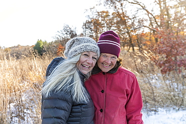 Smiling women wearing winter clothing, Mount Horeb, Wisconsin, USA