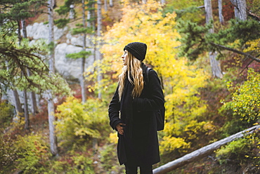 Young woman in autumn forest