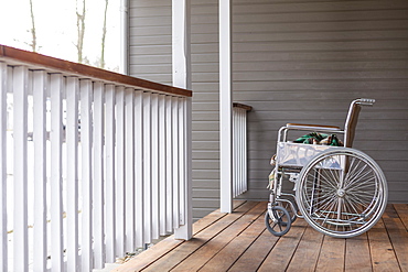 Empty wheelchair on porch