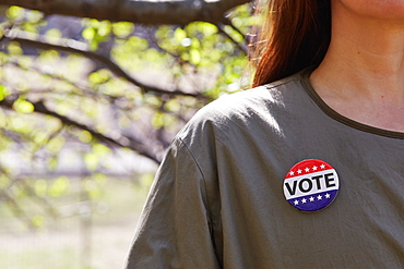 Woman with vote button on her top