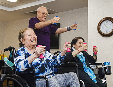 Smiling senior people exercising