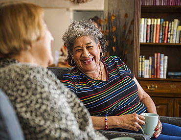 Smiling senior woman holding cup