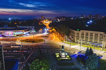 Moldova, Chisinau, Cityscape illuminated at dusk