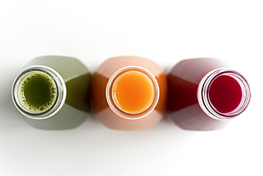 Healthy bottled juices shot from above