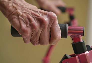 Close up of hands of senior woman on mobility walker