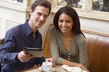 Couple paying bill at restaurant