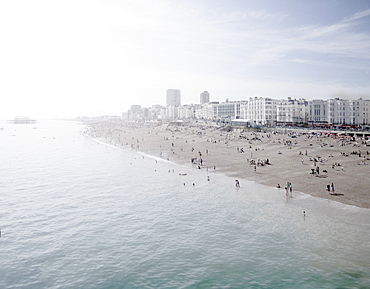 United Kingdom, England, Brighton, People resting at urban beach