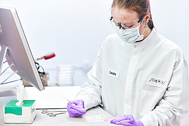 Female technician working with tests