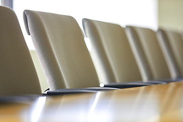 Office chairs in row at table