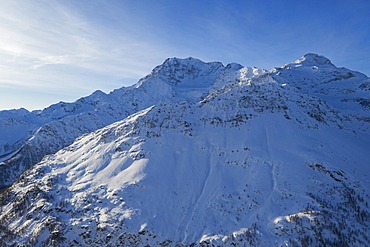 Switzerland, Canton Wallis, Simplon pass, Mountains on sunny day in winter