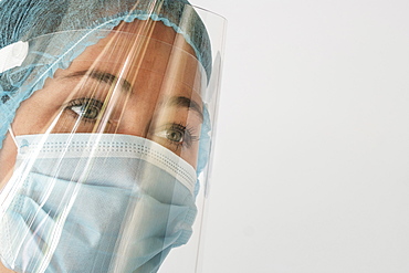 Nurse in mask and face shield