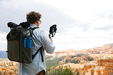 USA, Utah, Bryce Canyon, Man recording video in national park