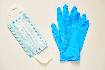 Studio shot of surgical mask and latex gloves