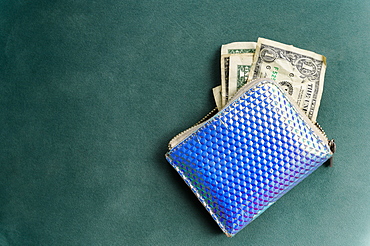 Overhead view of one dollar banknotes in purse