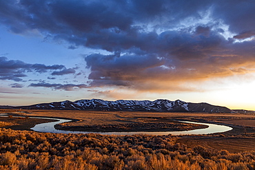 USA, Idaho, Picabo, Sunset over plain and mountain range